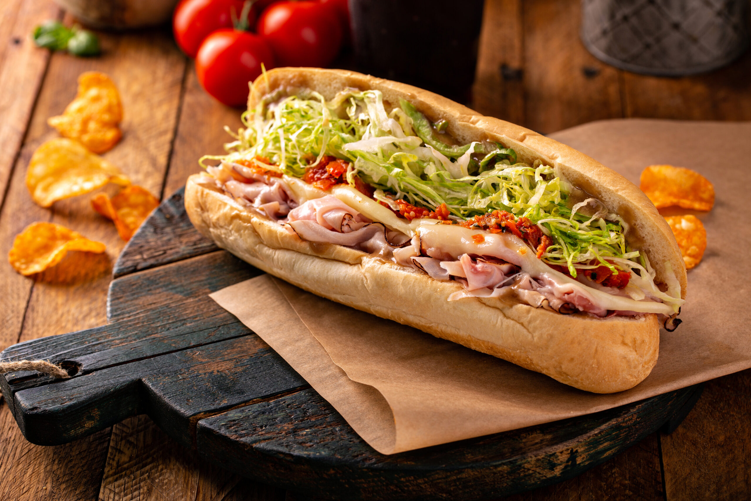 Italian hoagie with sliced deli meats, cheese and lettuce on a roll